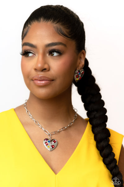 Heart Necklace and Earring Combo - Paparazzi heart shaped necklace and earring with Brushed with shimmery pink, yellow, blue, and red gems in round, teardrop and emerald cuts - TheSavvyShoppersJewelryStore